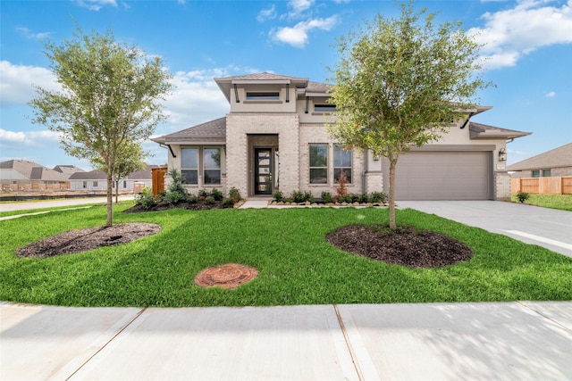 12722 Noble Fields Way, Cypress, TX 77433 - prairie-style house with driveway, stucco siding, a garage, and brick siding