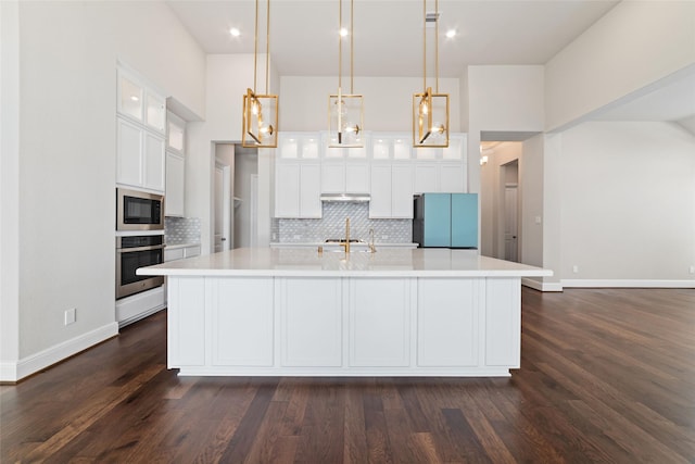12722 Noble Fields Way, Cypress, TX 77433 - kitchen with stainless steel oven, fridge, built in microwave, light countertops, and recessed lighting