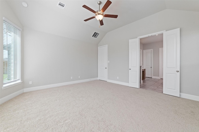 12722 Noble Fields Way, Cypress, TX 77433 - unfurnished bedroom with lofted ceiling, light carpet, and a ceiling fan