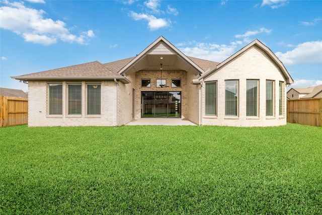 12722 Noble Fields Way, Cypress, TX 77433 - rear view of house with a fenced backyard, a patio area, a shingled roof, and brick siding