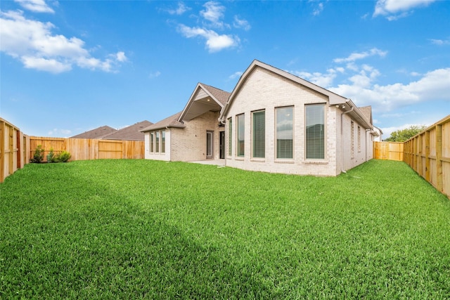 12722 Noble Fields Way, Cypress, TX 77433 - rear view of house with a fenced backyard and brick siding