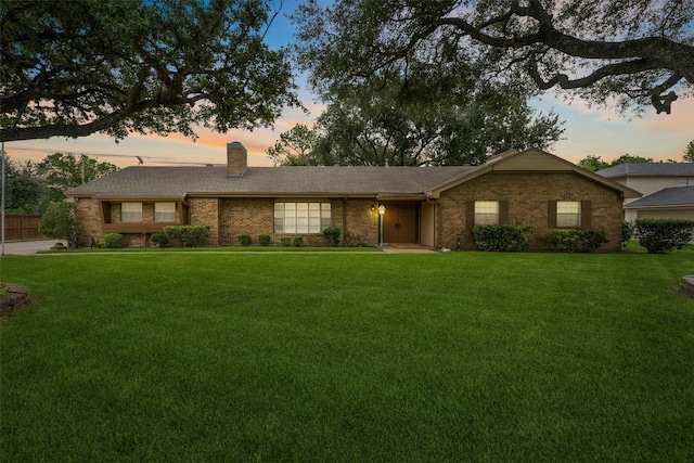 3101 Yost Blvd, Pearland, TX 77581 - ranch-style house featuring a chimney, a front yard, and brick siding