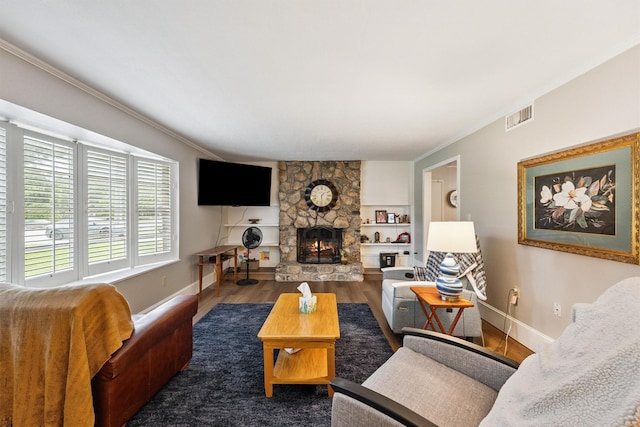 3101 Yost Blvd, Pearland, TX 77581 - living area with wood finished floors, crown molding, and a fireplace