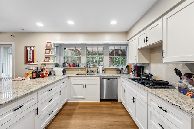 3101 Yost Blvd, Pearland, TX 77581 - kitchen featuring dishwasher, white cabinets, backsplash, gas cooktop, and recessed lighting