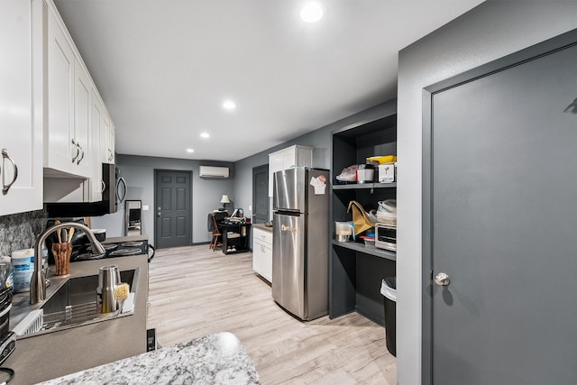 3101 Yost Blvd, Pearland, TX 77581 - kitchen with stainless steel appliances, a wall mounted air conditioner, white cabinets, a desk, and recessed lighting