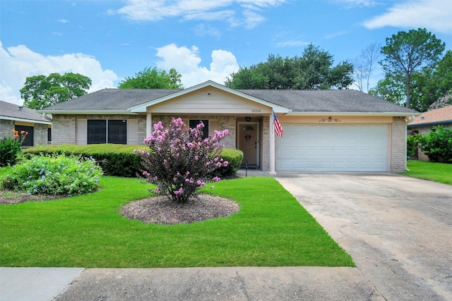 10314 Paintbrush Ln, Sugar Land, TX 77498 - ranch-style home with concrete driveway, a front lawn, an attached garage, and brick siding