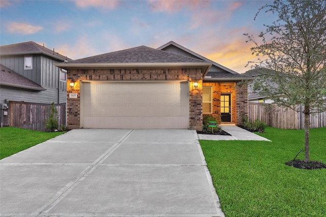 6609 Lahna Oak Dr, Conroe, TX 77304 - ranch-style home with brick siding, a garage, concrete driveway, and roof with shingles