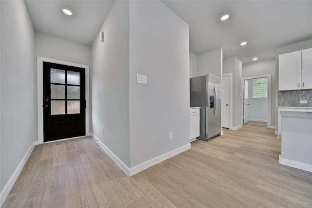6609 Lahna Oak Dr, Conroe, TX 77304 - foyer entrance featuring light wood-type flooring and recessed lighting