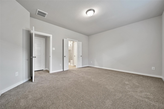 6609 Lahna Oak Dr, Conroe, TX 77304 - unfurnished bedroom with carpet floors and connected bathroom