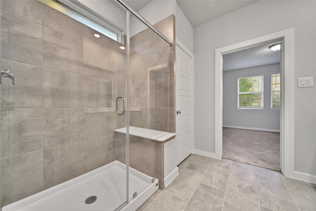 6609 Lahna Oak Dr, Conroe, TX 77304 - bathroom featuring a shower stall and baseboards