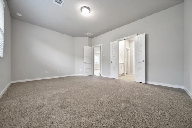 6609 Lahna Oak Dr, Conroe, TX 77304 - unfurnished bedroom featuring carpet and ensuite bathroom
