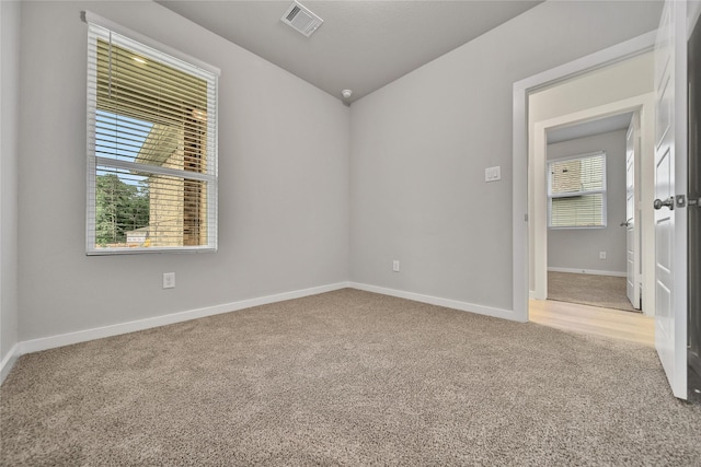 6609 Lahna Oak Dr, Conroe, TX 77304 - carpeted spare room with baseboards and lofted ceiling