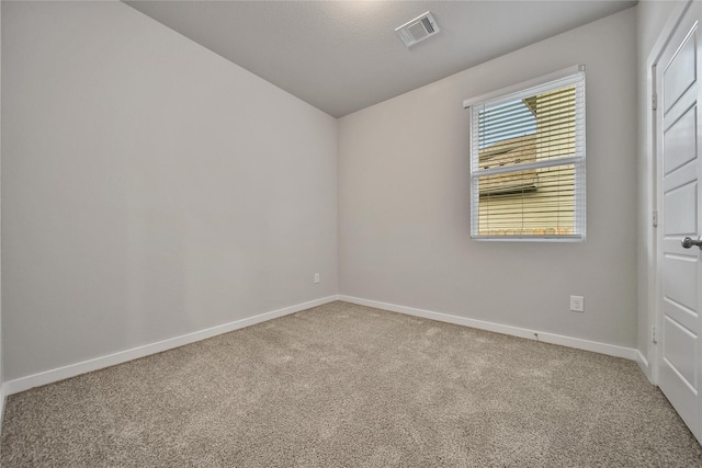 6609 Lahna Oak Dr, Conroe, TX 77304 - carpeted spare room with lofted ceiling and baseboards