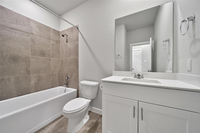 6609 Lahna Oak Dr, Conroe, TX 77304 - full bathroom featuring wood finished floors, vanity, and shower / tub combination