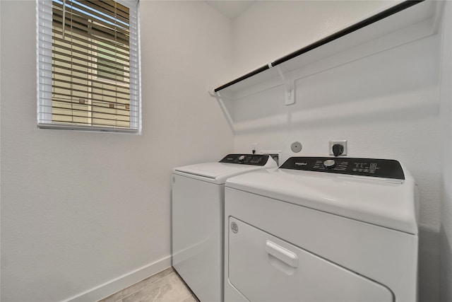 6609 Lahna Oak Dr, Conroe, TX 77304 - laundry area with washing machine and dryer and baseboards