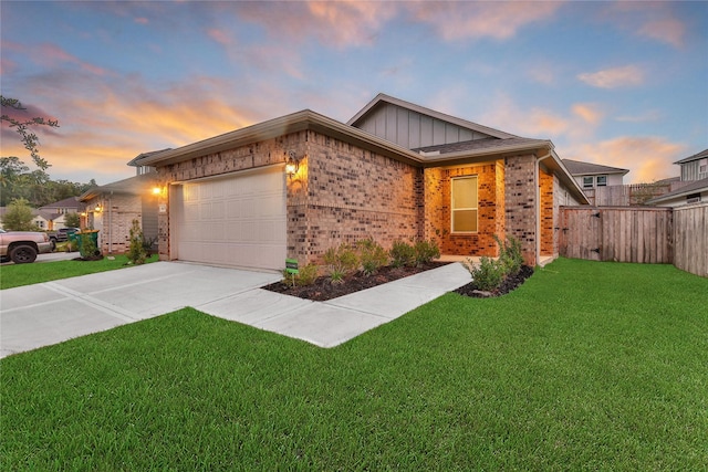 6609 Lahna Oak Dr, Conroe, TX 77304 - view of front of property with brick siding, board and batten siding, a garage, and concrete driveway