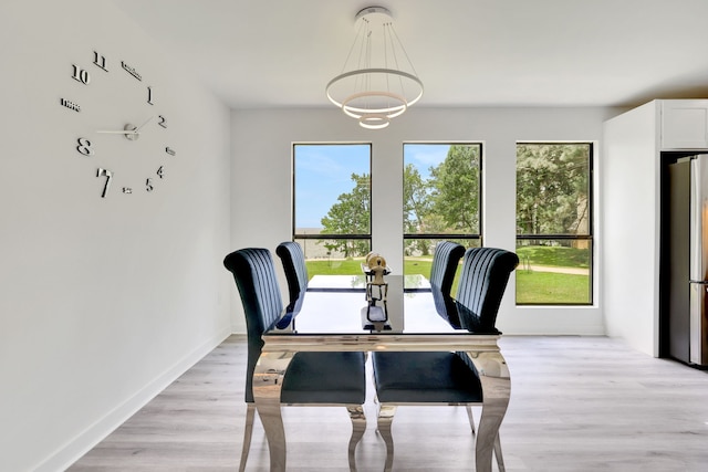 118 Hickory Pnes, Livingston, TX 77351 - dining area featuring light wood-style floors and a chandelier