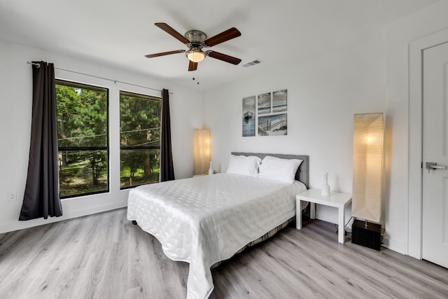 118 Hickory Pnes, Livingston, TX 77351 - bedroom with wood finished floors and a ceiling fan