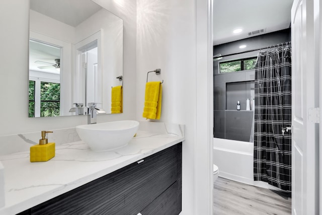 118 Hickory Pnes, Livingston, TX 77351 - full bath featuring vanity, healthy amount of natural light, ceiling fan, and shower / bath combo with shower curtain