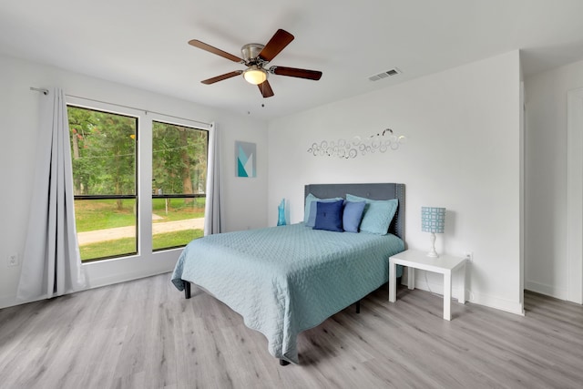 118 Hickory Pnes, Livingston, TX 77351 - bedroom with wood finished floors and a ceiling fan