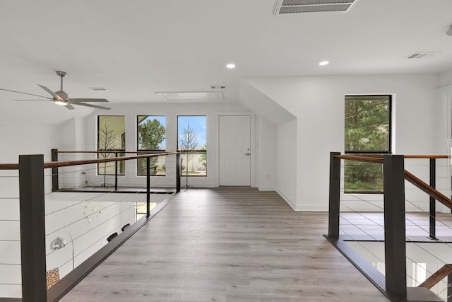 118 Hickory Pnes, Livingston, TX 77351 - corridor featuring healthy amount of natural light, recessed lighting, and wood finished floors