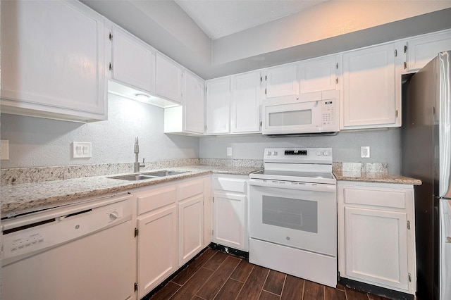 10318 Rockcrest Dr, Houston, TX 77041 - kitchen with white appliances, dark wood-type flooring, white cabinets, a textured wall, and light stone countertops