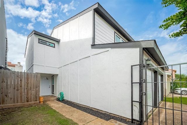 10318 Rockcrest Dr, Houston, TX 77041 - view of property exterior featuring stucco siding