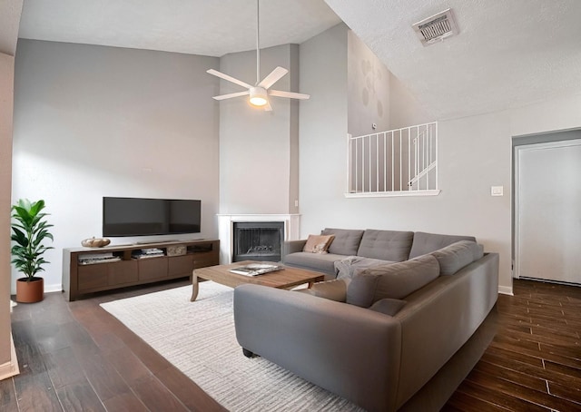10318 Rockcrest Dr, Houston, TX 77041 - living area with wood finished floors, high vaulted ceiling, a ceiling fan, and a fireplace