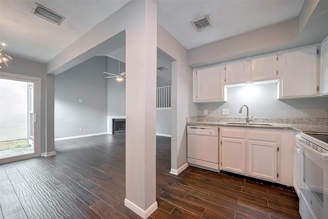 10318 Rockcrest Dr, Houston, TX 77041 - kitchen with white appliances, white cabinetry, ceiling fan, and dark wood-style floors