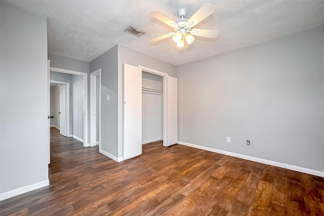 10318 Rockcrest Dr, Houston, TX 77041 - unfurnished bedroom featuring wood finished floors, a closet, a ceiling fan, and a textured ceiling