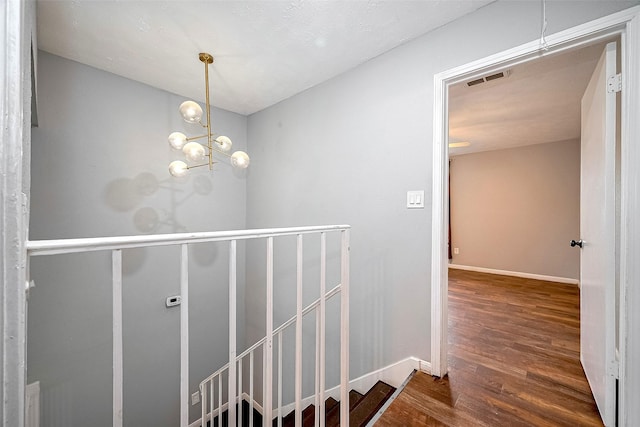 10318 Rockcrest Dr, Houston, TX 77041 - staircase featuring wood finished floors and a chandelier
