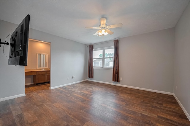 10318 Rockcrest Dr, Houston, TX 77041 - unfurnished room featuring ceiling fan, wood finished floors, and an office area