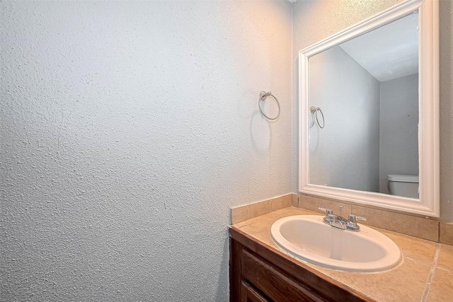 10318 Rockcrest Dr, Houston, TX 77041 - bathroom with vanity and a textured wall