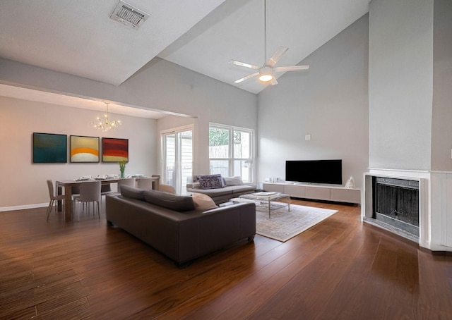 10318 Rockcrest Dr, Houston, TX 77041 - living area featuring high vaulted ceiling, dark wood-style floors, a chandelier, ceiling fan, and a fireplace