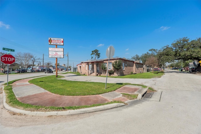 4110 N Main St, Houston, TX 77009 - view of asphalt street with traffic signs, sidewalks, and curbs