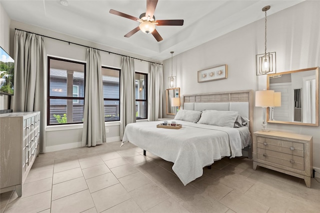 15247 Parkland Canyon Dr, Cypress, TX 77433 - bedroom with a tray ceiling, light tile patterned flooring, and ceiling fan