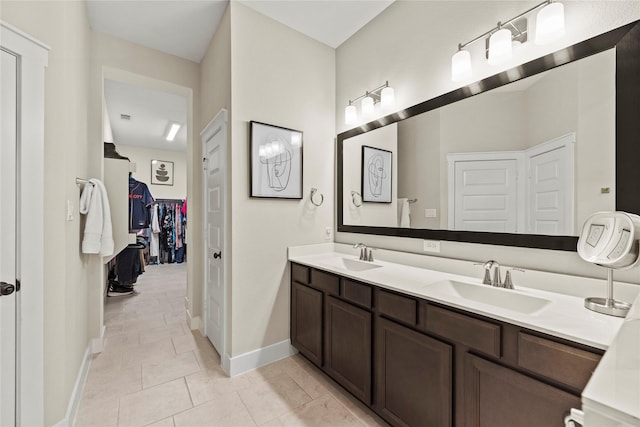 15247 Parkland Canyon Dr, Cypress, TX 77433 - full bathroom with double vanity, tile patterned floors, and a walk in closet