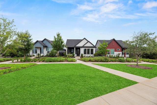 15247 Parkland Canyon Dr, Cypress, TX 77433 - view of front facade with a front lawn and board and batten siding