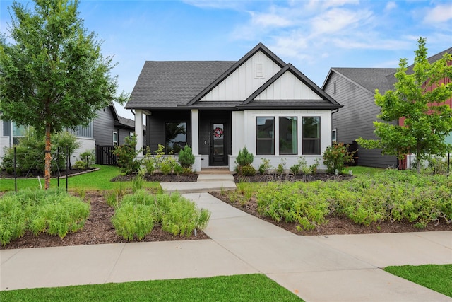 15247 Parkland Canyon Dr, Cypress, TX 77433 - modern inspired farmhouse featuring board and batten siding, a porch, and a shingled roof