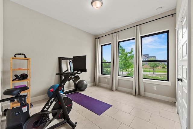 15247 Parkland Canyon Dr, Cypress, TX 77433 - workout room featuring healthy amount of natural light and light tile patterned floors