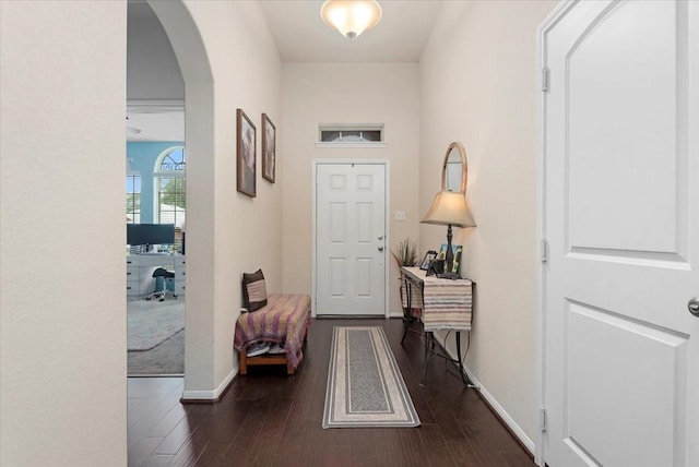 30119 Saw Oaks Dr, Magnolia, TX 77355 - entryway with dark wood-type flooring and arched walkways