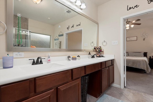 30119 Saw Oaks Dr, Magnolia, TX 77355 - bathroom with double vanity, ensuite bath, tile patterned floors, and ceiling fan