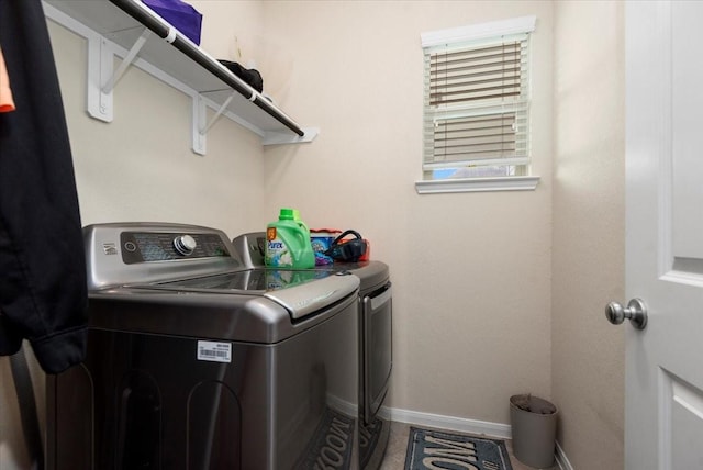 30119 Saw Oaks Dr, Magnolia, TX 77355 - laundry area with washing machine and dryer and baseboards