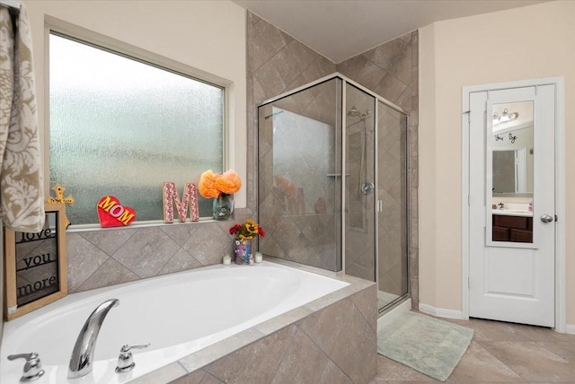 30119 Saw Oaks Dr, Magnolia, TX 77355 - full bath featuring a stall shower, a garden tub, and vanity