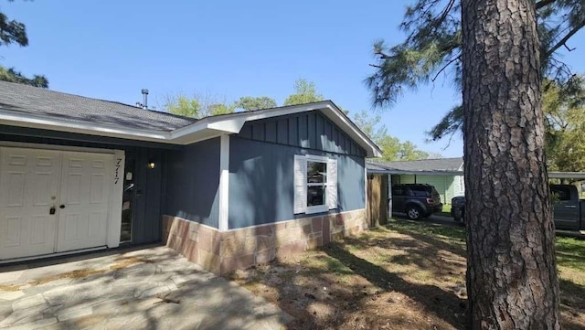 7717 Bigwood St, Houston, TX 77016 - view of front of home featuring board and batten siding and stone siding