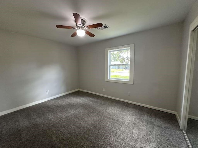 7717 Bigwood St, Houston, TX 77016 - unfurnished room with dark colored carpet and a ceiling fan