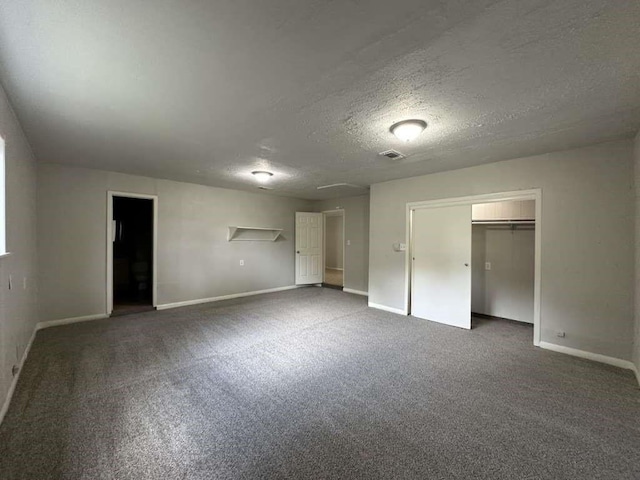 7717 Bigwood St, Houston, TX 77016 - unfurnished bedroom with a textured ceiling, carpet floors, and a closet