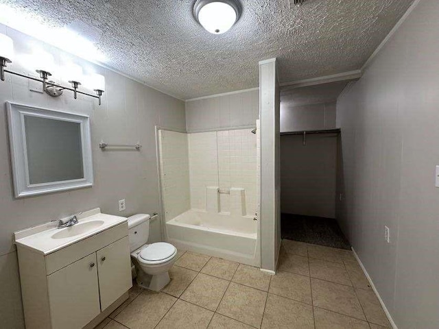 7717 Bigwood St, Houston, TX 77016 - bathroom featuring vanity, tile patterned flooring, a textured ceiling, and bathtub / shower combination