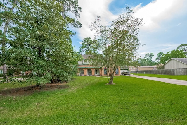 25107 Broughton St, Spring, TX 77373 - view of property hidden behind natural elements with concrete driveway