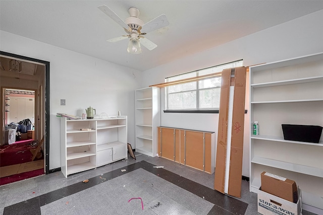 25107 Broughton St, Spring, TX 77373 - miscellaneous room featuring ceiling fan, inlaid floor details, and granite floors